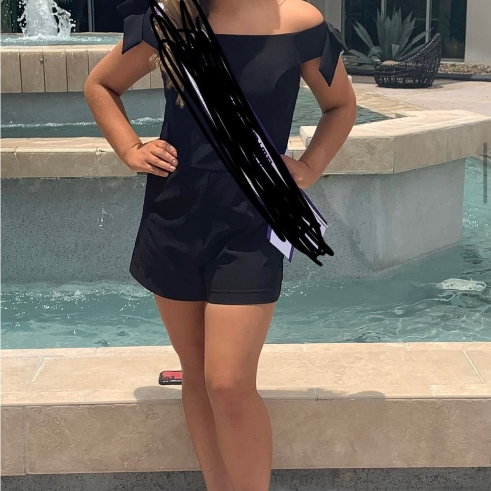 Black romper with bows at the shoulders